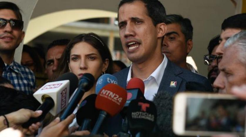 Juan Guaido speaks to the press next to his wife Fabiana Rosales afp