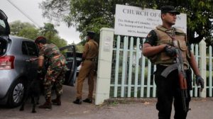 Security personnel stand guard outside an Anglican church reuters