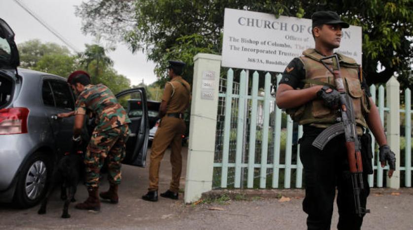 Security personnel stand guard outside an Anglican church reuters